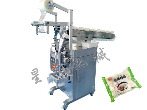 成都鏈鬥式顆粒包裝機/袋裝涼皮自動包裝機