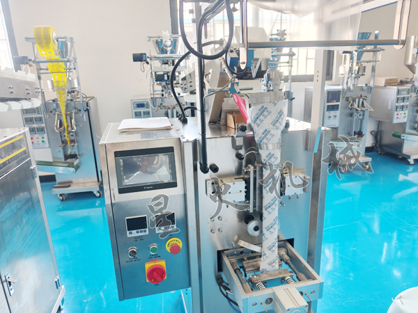 成都鏈鬥式顆粒包裝機/袋裝涼皮自動包裝機